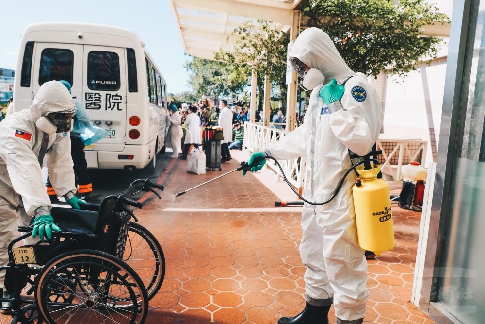 Chemical soldiers disinfect transferring patients’ belongings